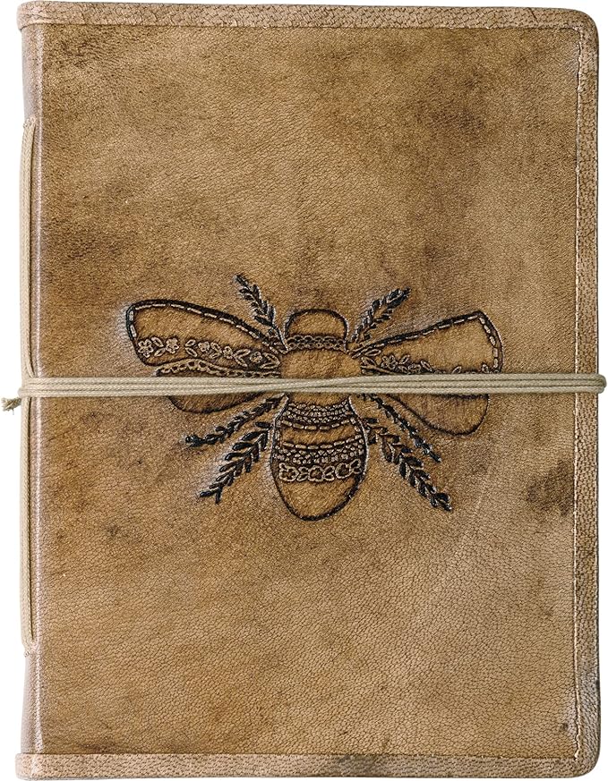 Primitives By Kathy Leather Bound Journal Featuring an Intricate Debossed Bee Design on the Front Cover. The Bee Journal Includes 96 Unlined Pages.